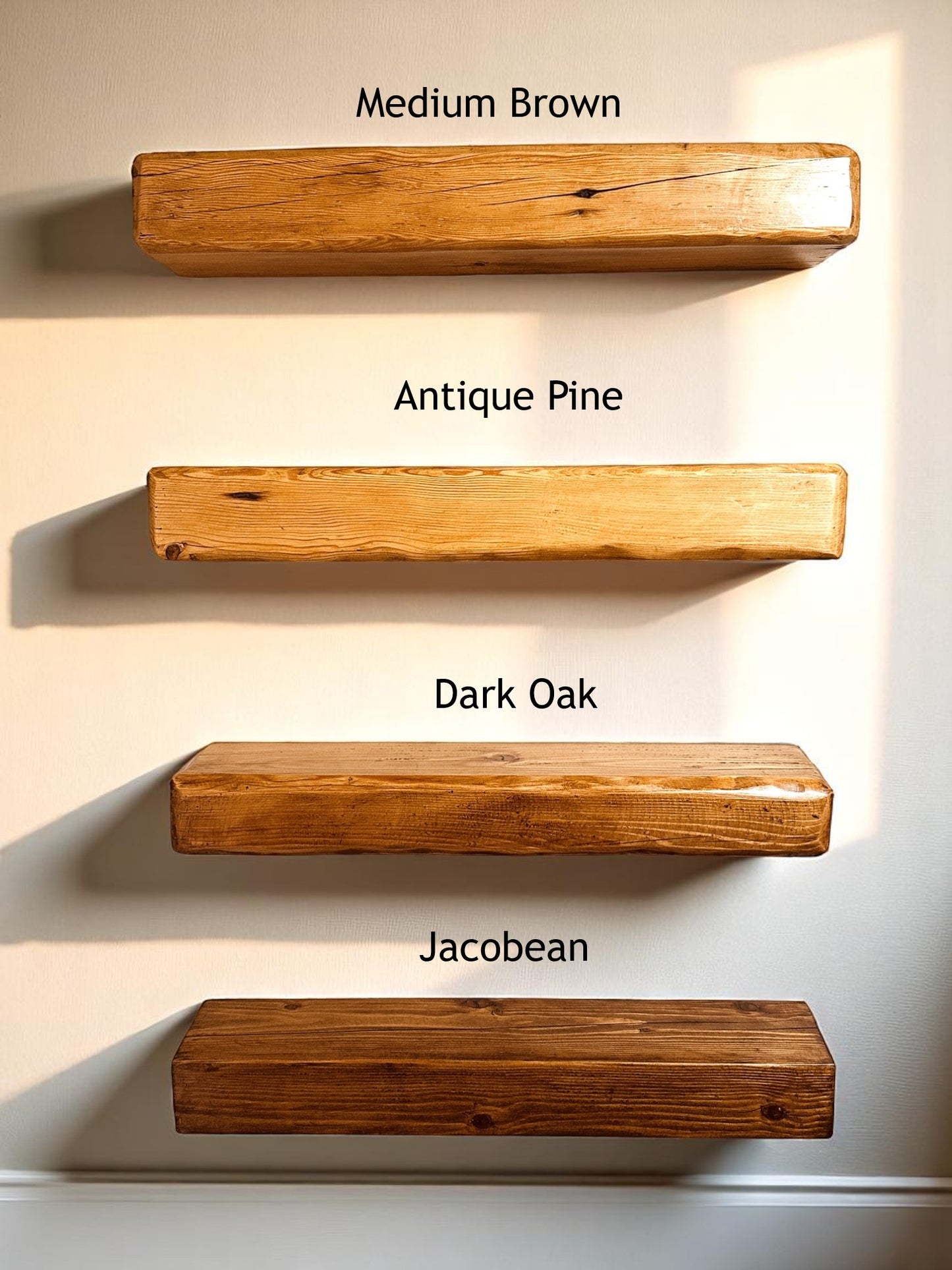 Four wooden shelves in different finishes on a light background