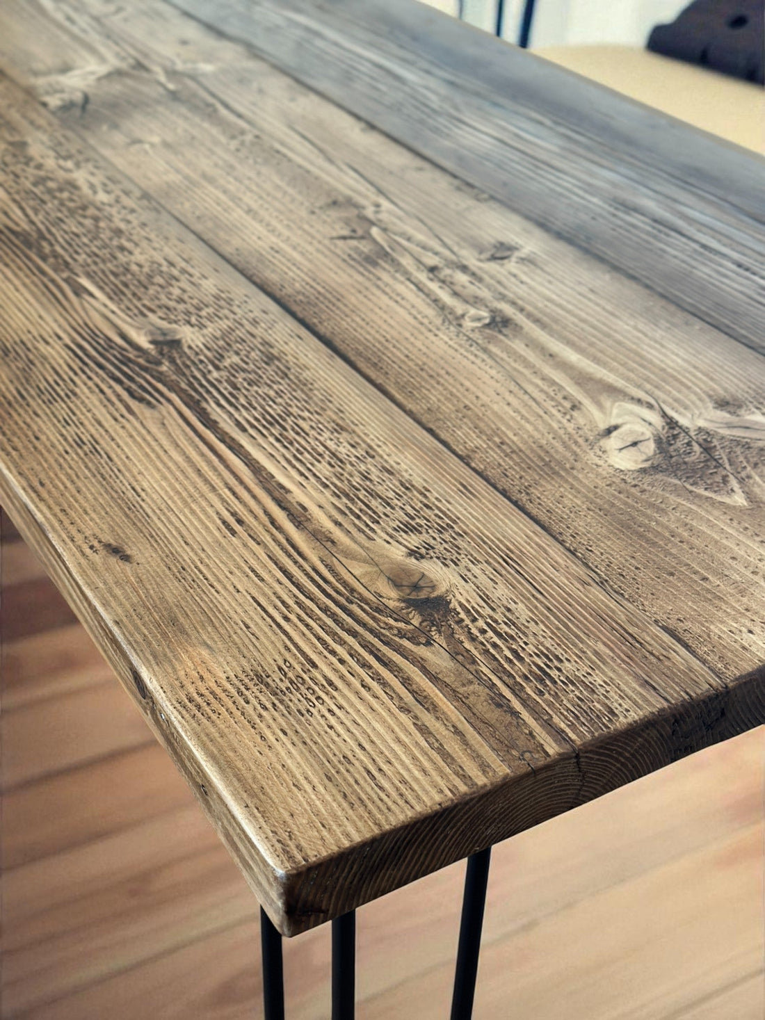 Rustic reclaimed wood dining table with benches in UK home